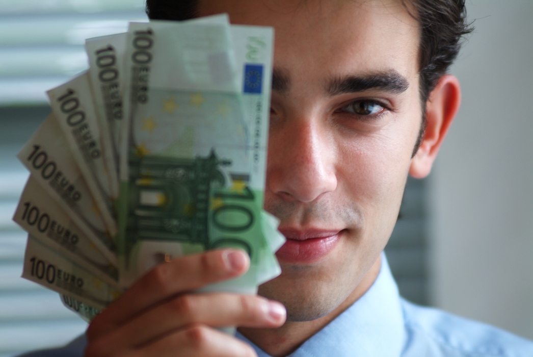 Man Holding Euro Money Bills