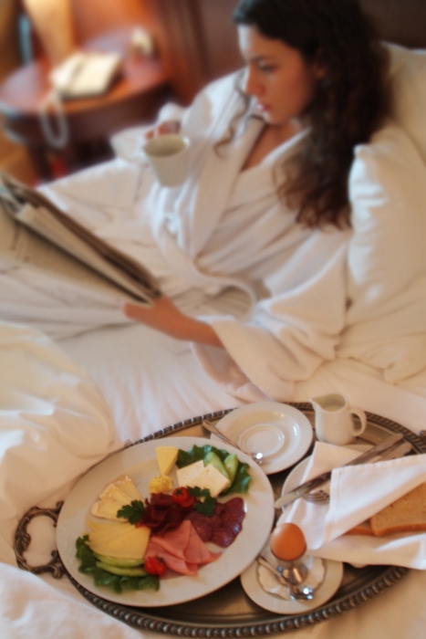 Woman Having Breakfast in Room