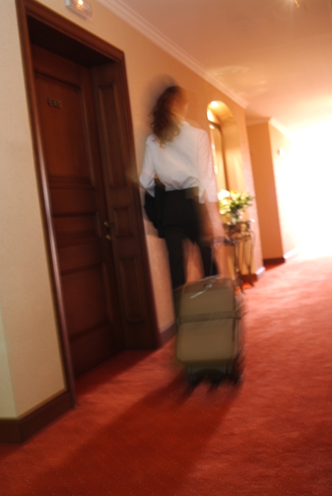 Businesswoman Leaving Hotel Room