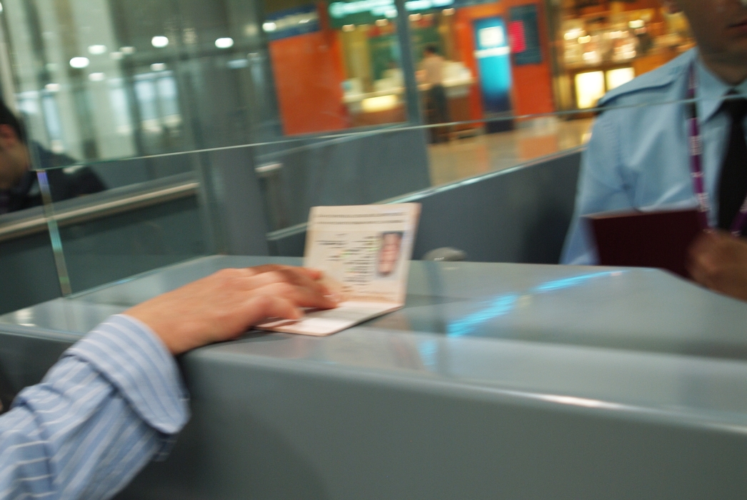 Showing Passport in Airport Terminal