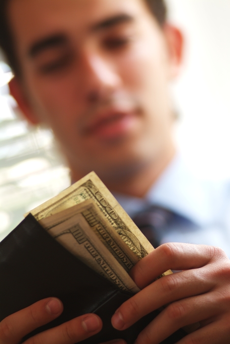 Man Counting U.S. Dollar Money Bills