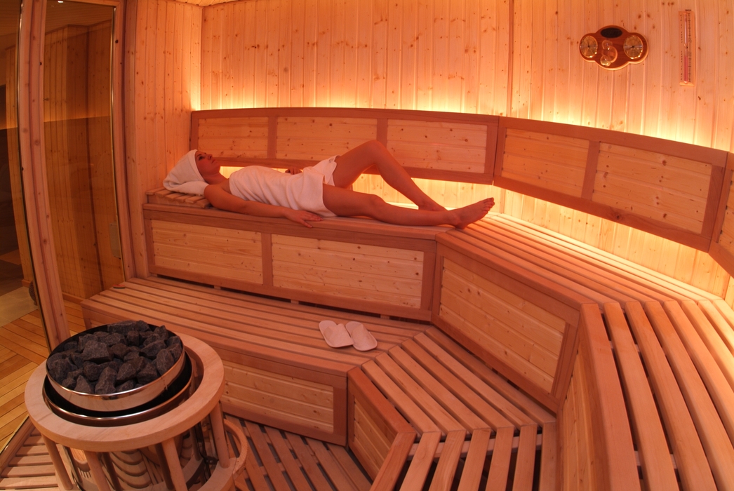 Woman Relaxing in the Sauna