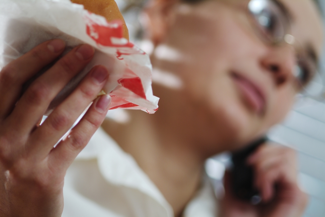 Woman Talking on the Phone During Lunch