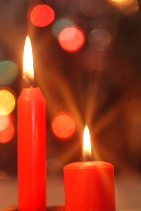 Two Red Candles with Shimmering Lights
