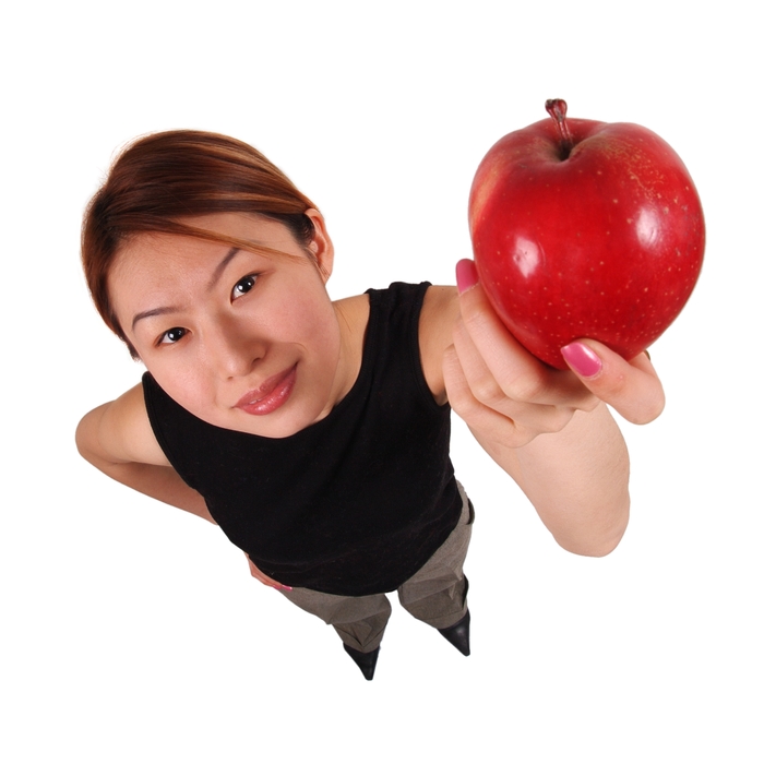 Businesswoman Holding a Red Apple