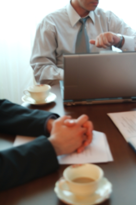 Businessmen Discussing Strategy & Having Coffee