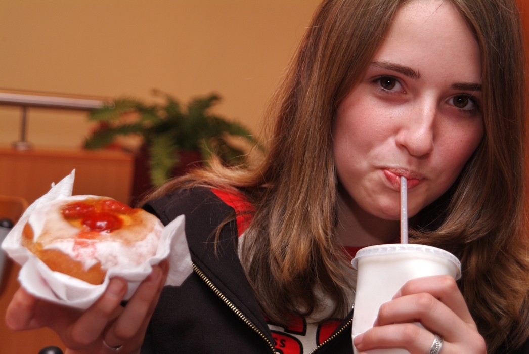 Girl Enjoying Cold Drink and a Snack