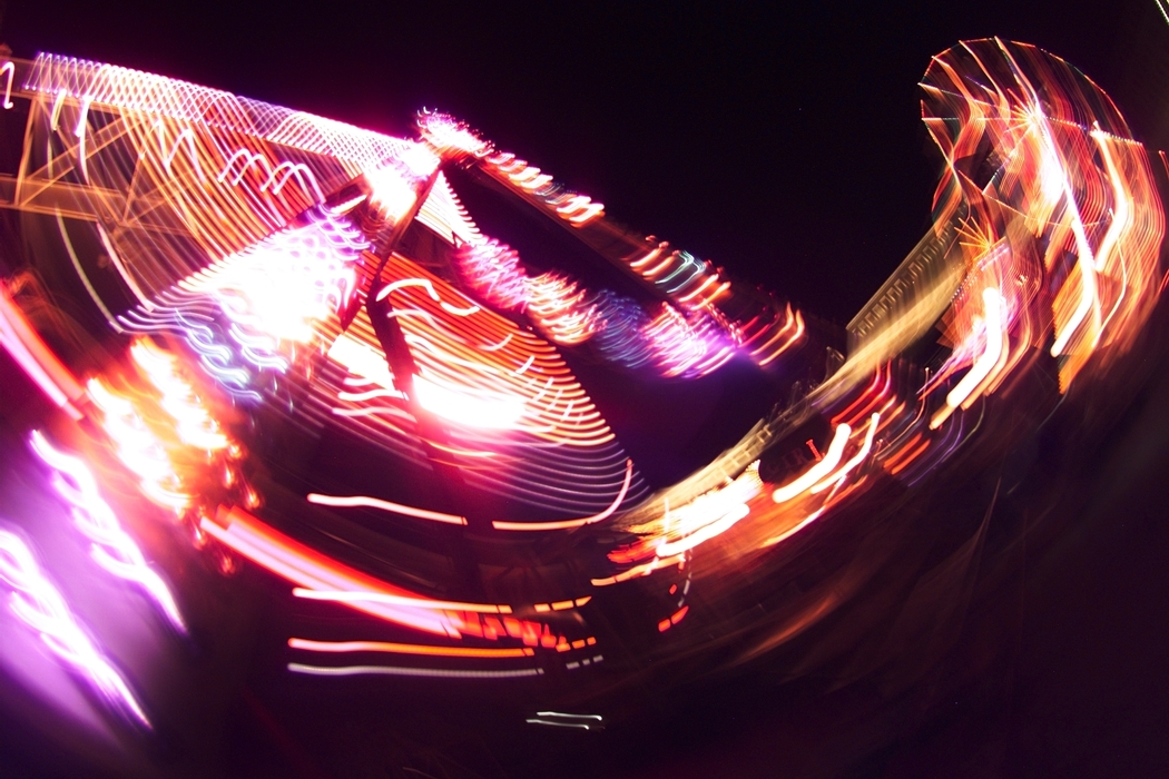 Amusement Park Ride with Colorful Lights at Night
