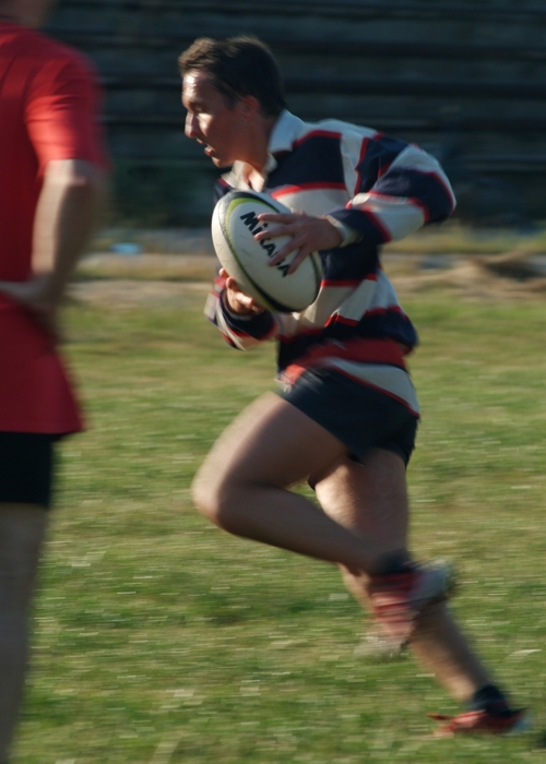 Rugby Player Runs with the Ball
