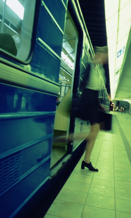 Businesswoman Getting Off The Subway