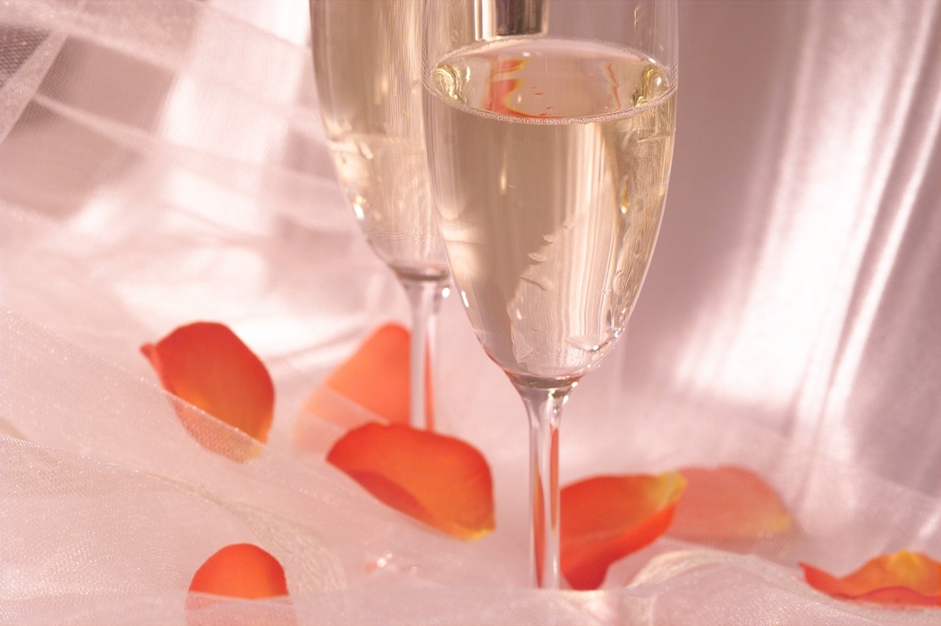 The Wedding Day:  Champagne Glasses with Flower Petals