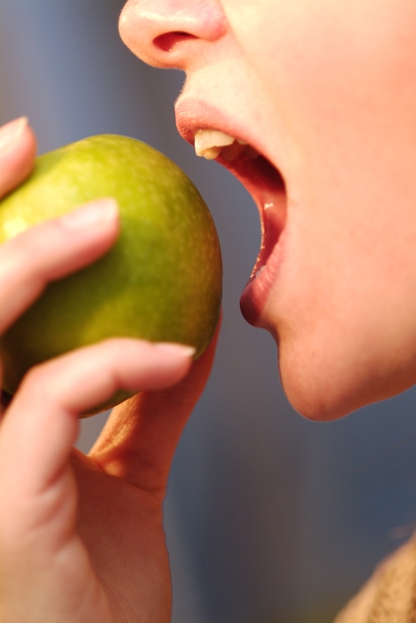 Woman Eating An Apple