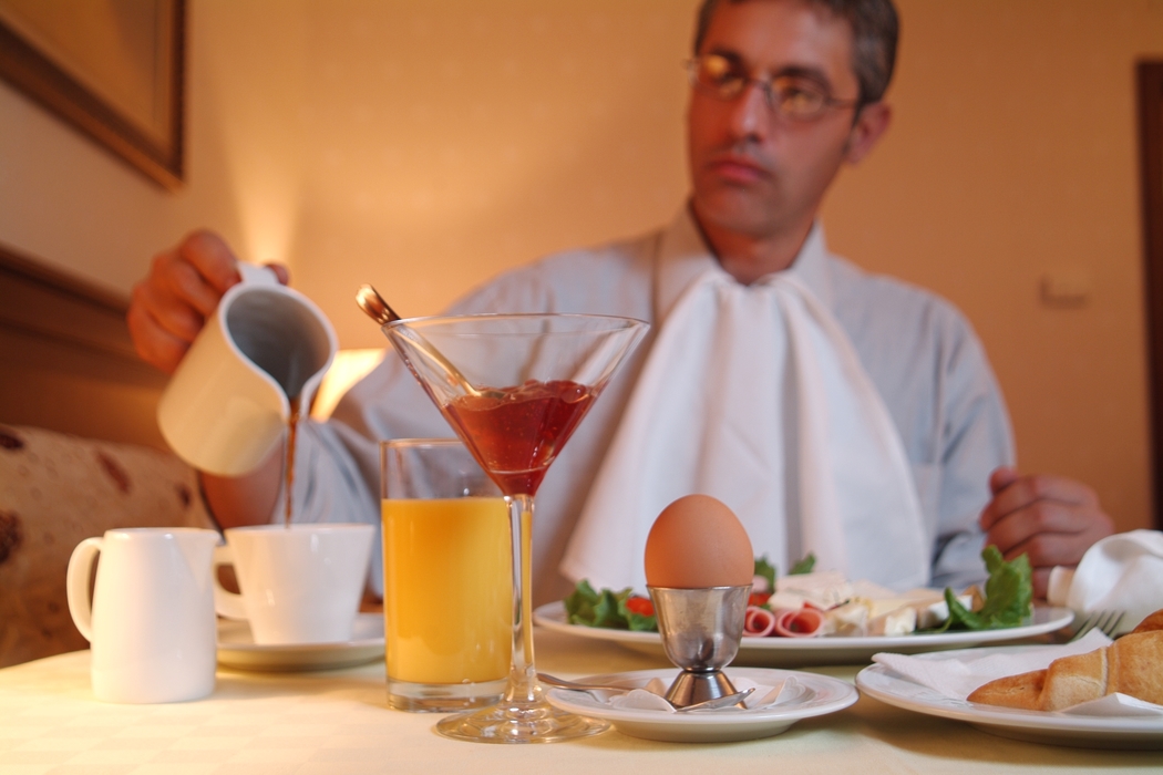 Businessman Eating Breakfast in Room