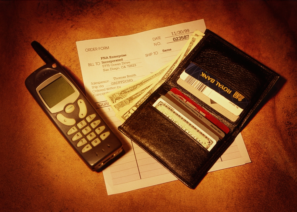 Cell Phone Next to An Open Wallet