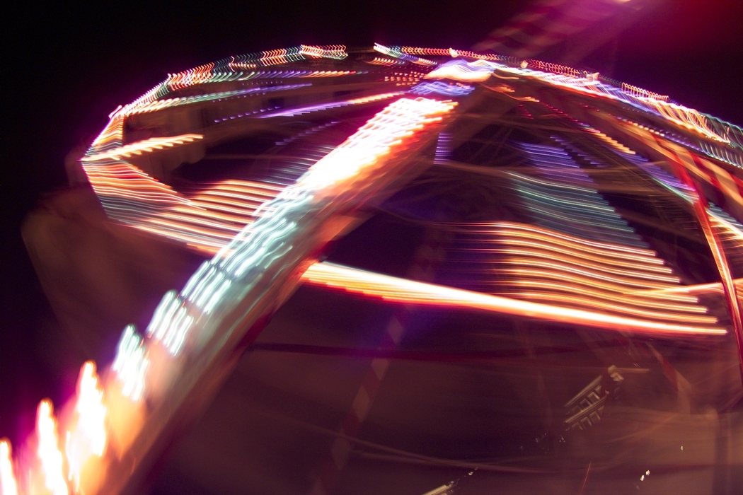 Amusement Park Ride with Colorful Lights at Night
