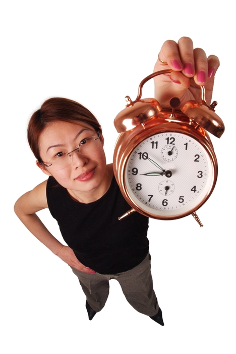 Businesswoman Holding Alarm Clock