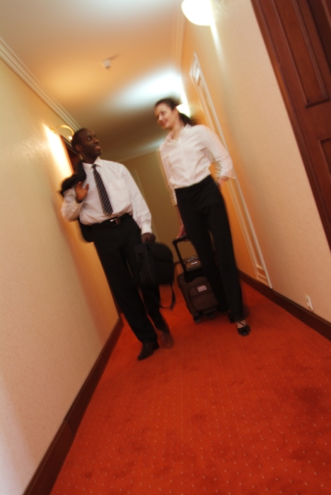 Man & Woman Leaving Their Hotel Rooms