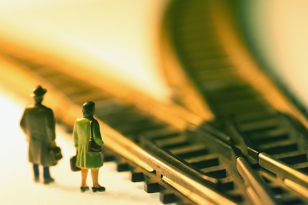 Toy People Standing At Train Tracks