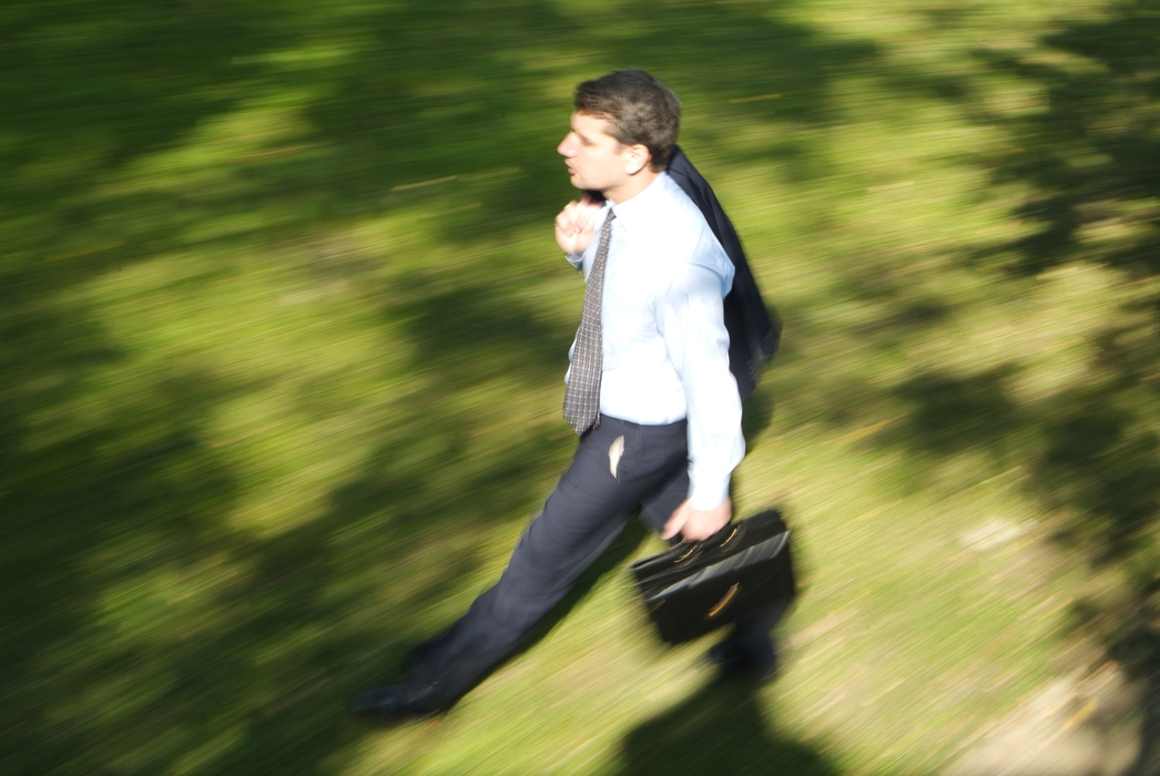 Businessman Walking in the Park