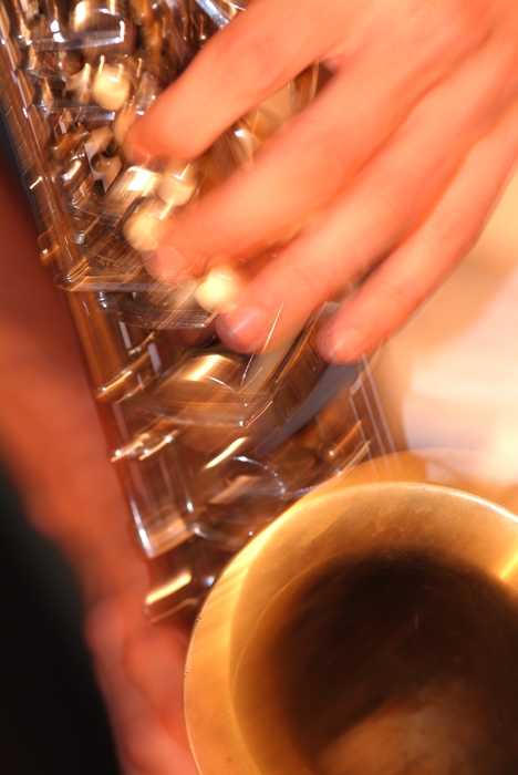 Symphony Orchestra Saxophonist Fingers on Keys