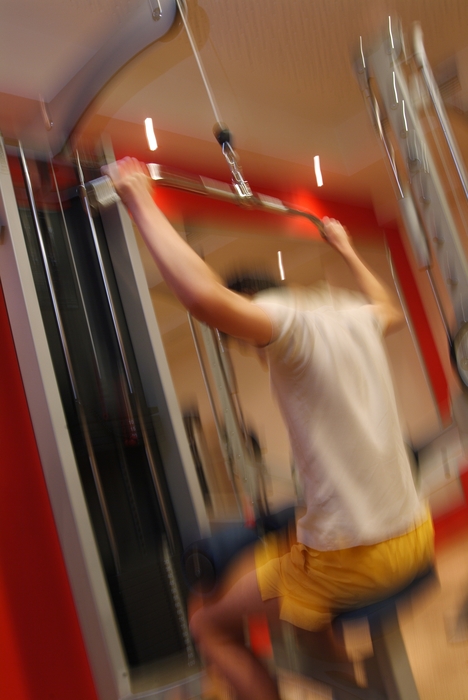 Man Performing Lat Pull Downs