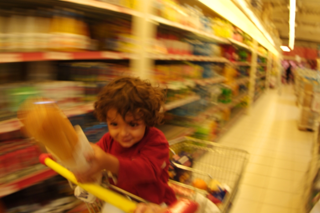 Child with Grocery Cart at Supermarket