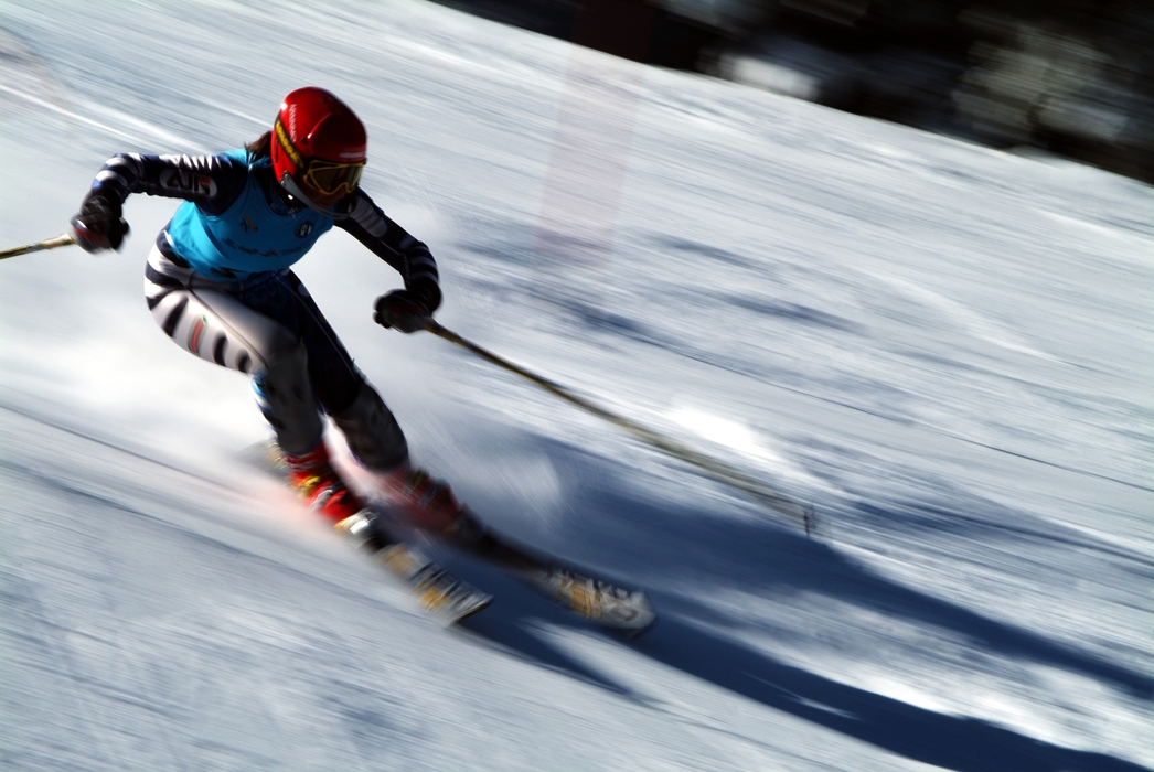 Downhill Skier Negotiates a Turn During Downhill Ski Race