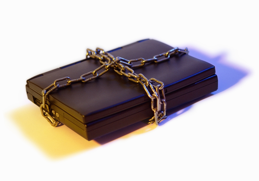 Notebook Computer Closed, Locked in Chains