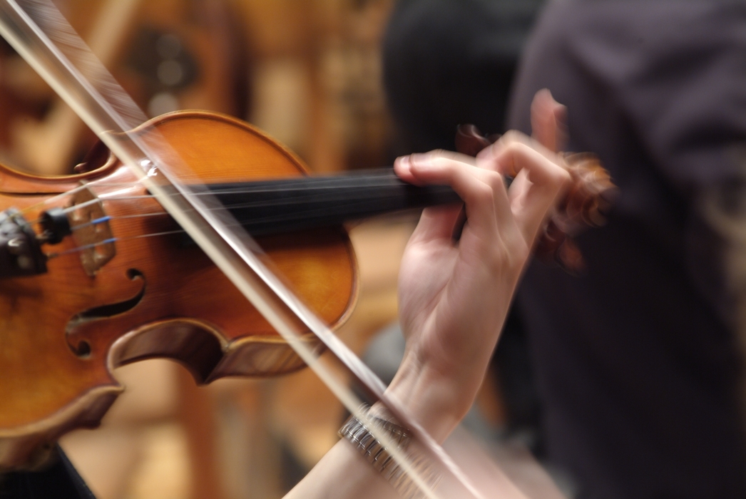 Concert Violinist in the Orchestra Fingering and Bowing