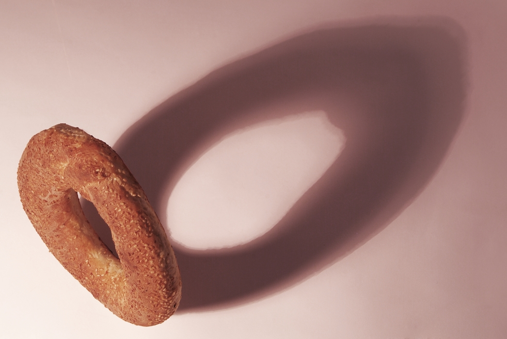 Sesame Seed Bagel with Dramatic Shadow