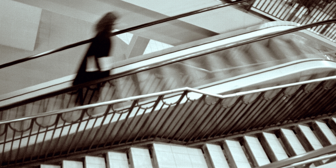 Businesswoman Going Up Stairs