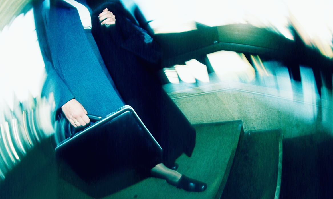 Businesswoman Walking Down Stairs