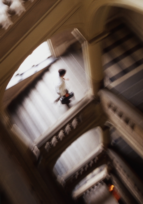 Businesswoman Walking Up Stairs