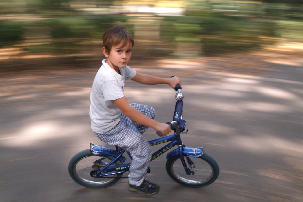 Boy Riding His Bike
