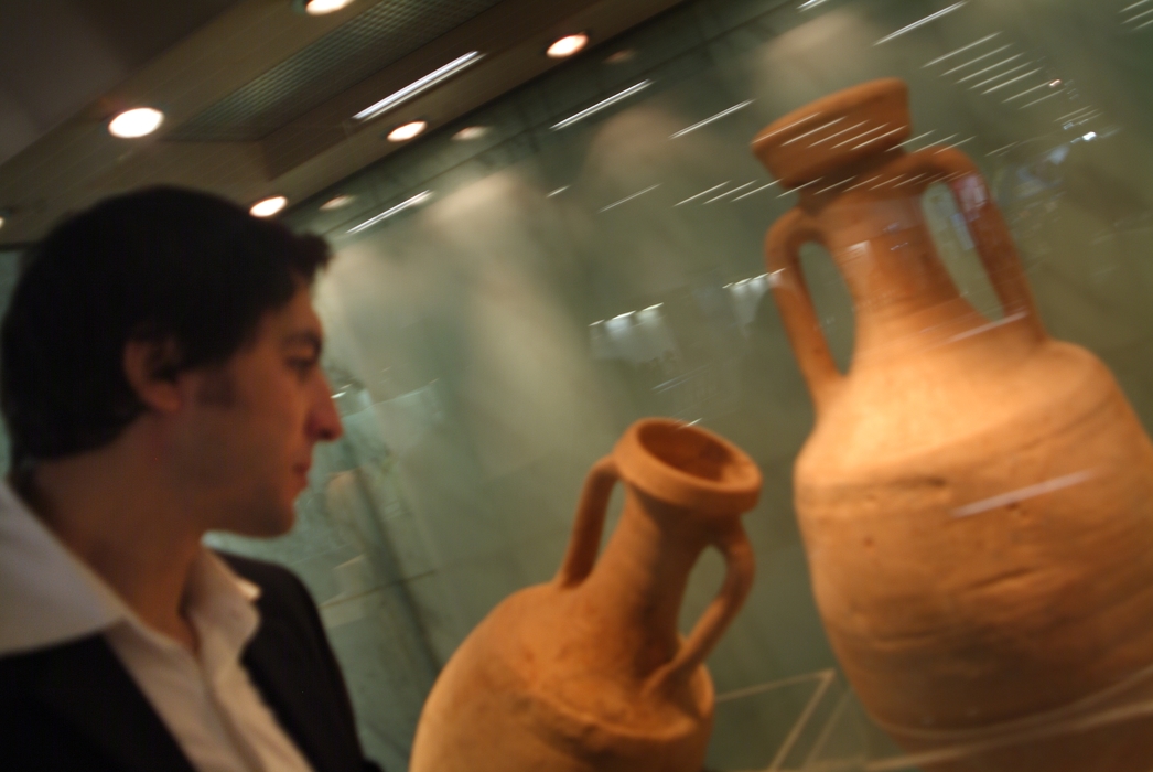 Businessman in Museum with Pottery