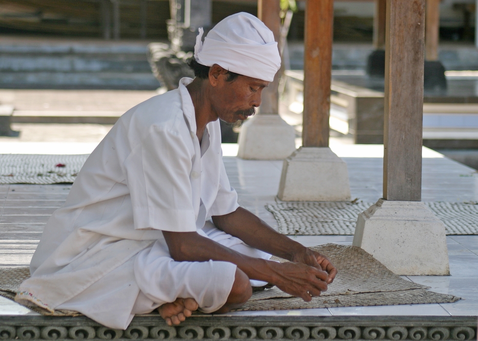 Hindu Prays at Temple, Bali, Indonesia