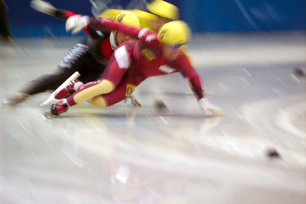 Speed Skater Trying to Avoid a Fall
