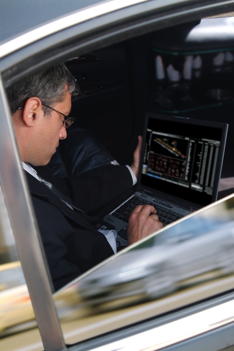 Businessman Working in a Limousine