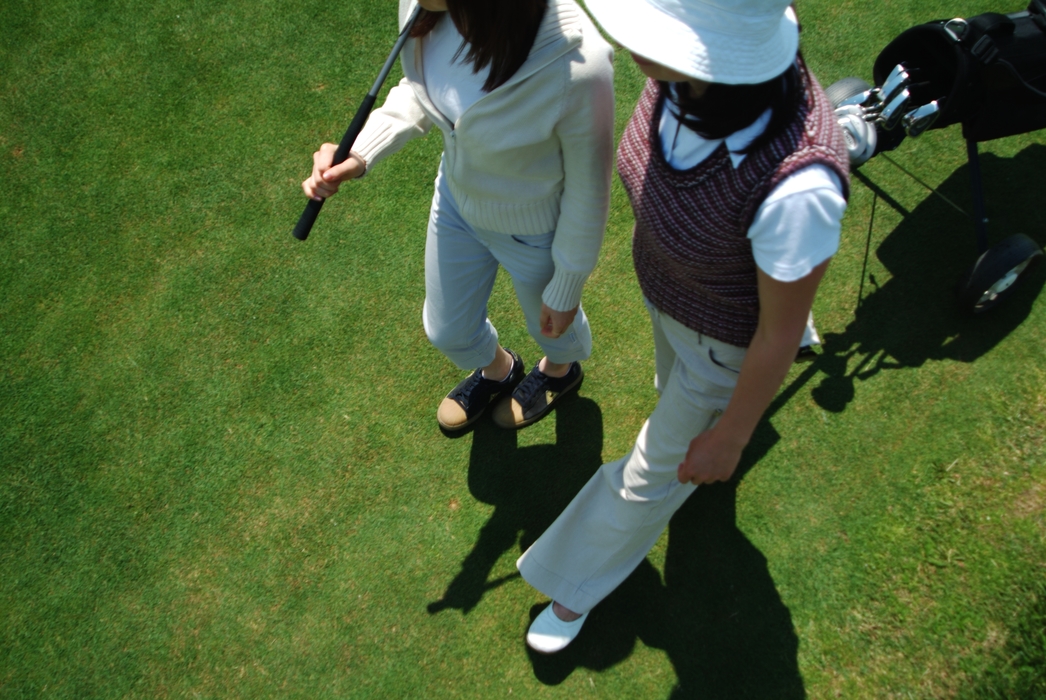 Female Golfers Walking to The Next Hole