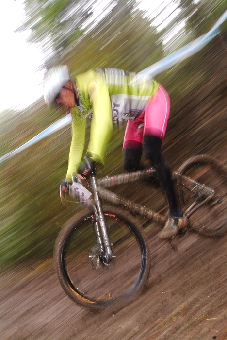 Cyclist Racing Downhill on Mountain bike