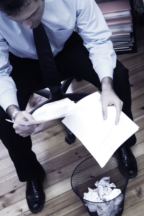 Businessman Looking Through Documents