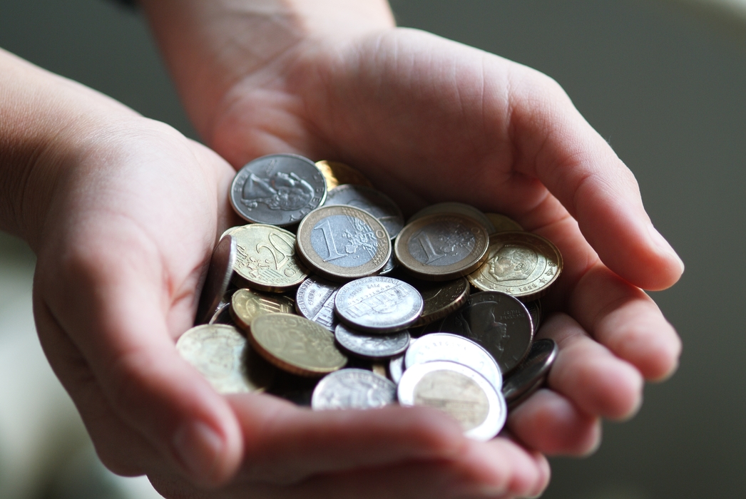 Hands Full of Euro Coins