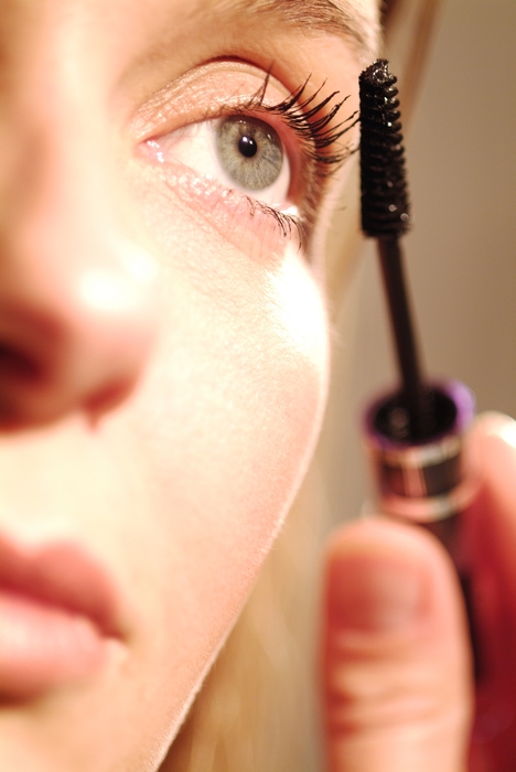 Woman Applying Her Mascara