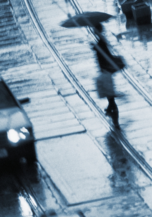 Businessman Walking in The Rain