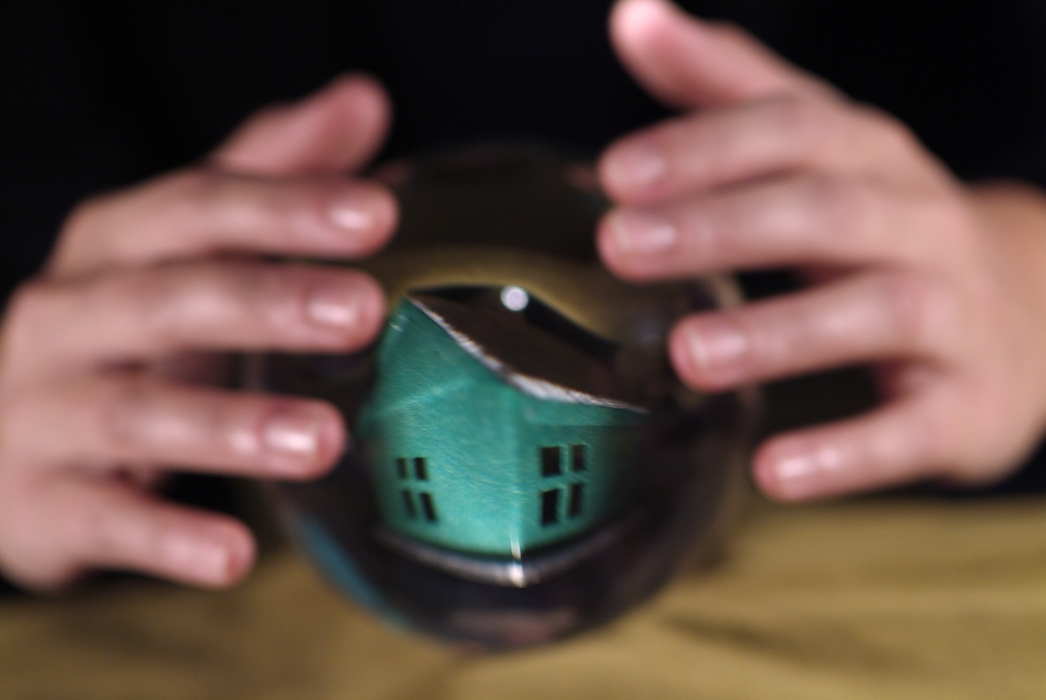 Hands and Crystal Ball with House Inside