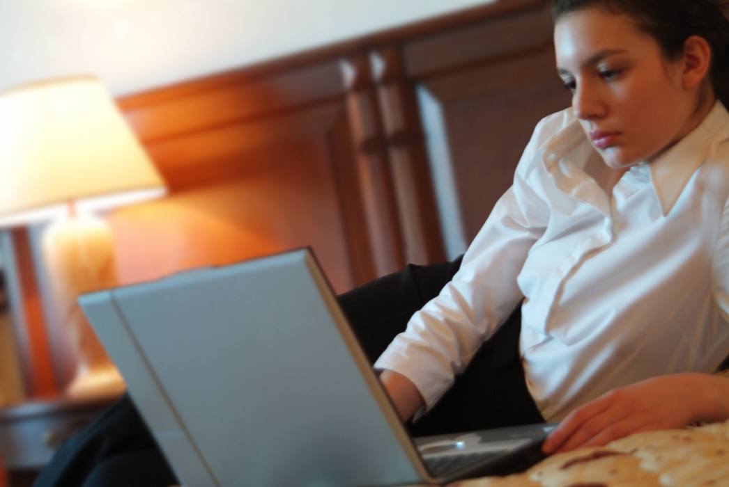 Businesswoman Working in Hotel Room