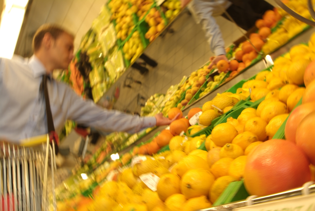 Selecting Fruit at Supermarket