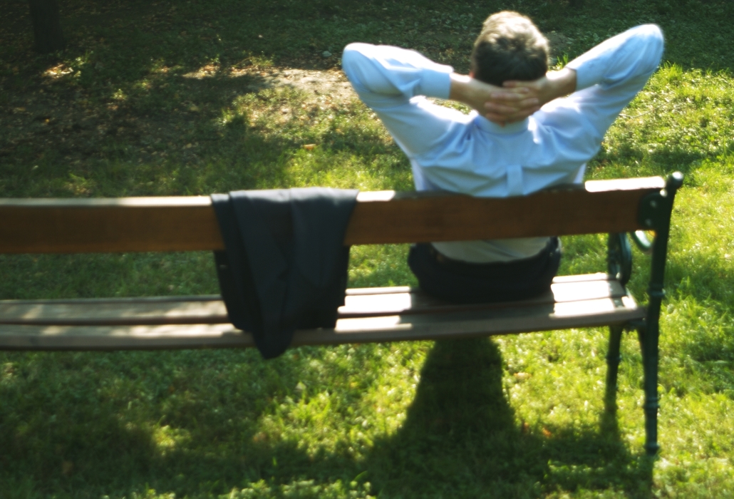 Businessman Relaxing on a Park Bench