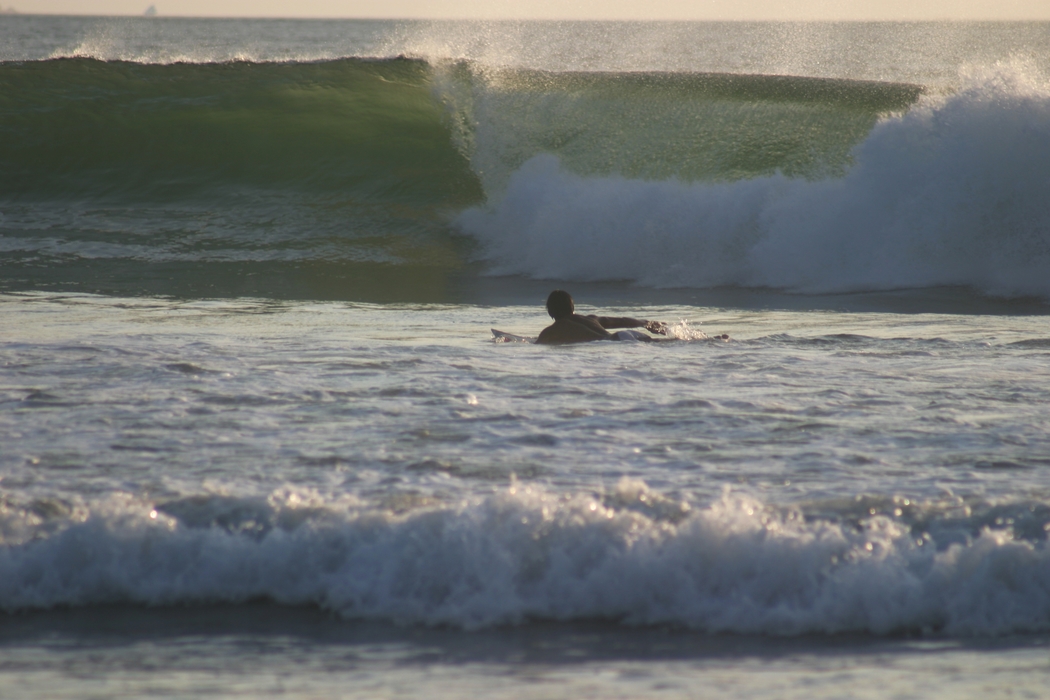 Surfer Waits for the Right Wave