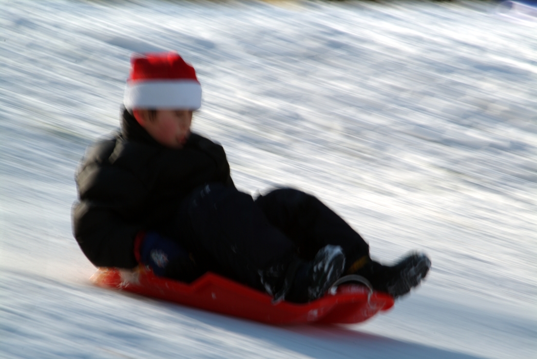 Winter Fun Sliding Down the Hill